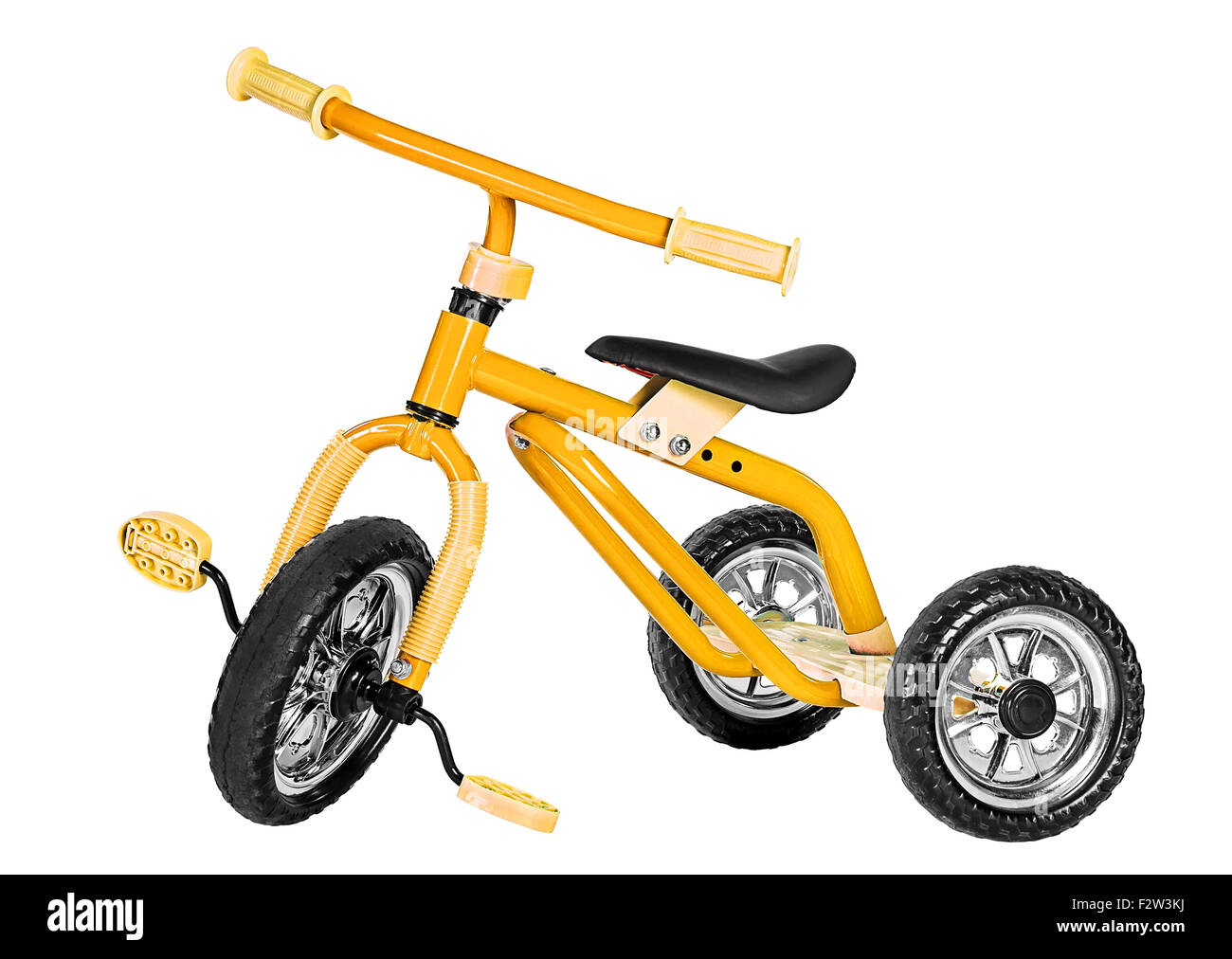 Enfants tricycle jaune isolé sur fond blanc Banque D'Images