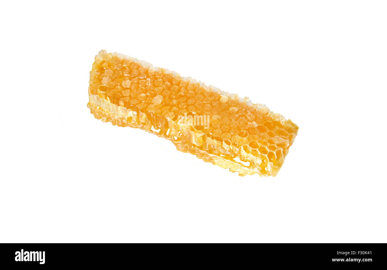 Barre d'abeilles/ stick à base de produits frais du miel bio de thym sauvage grecque dentelle sur fond blanc. Vue avant Vue diagonale/ Banque D'Images