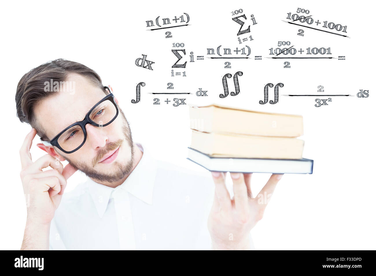 Image composite de geeky jeune homme à la pile de livres à Banque D'Images