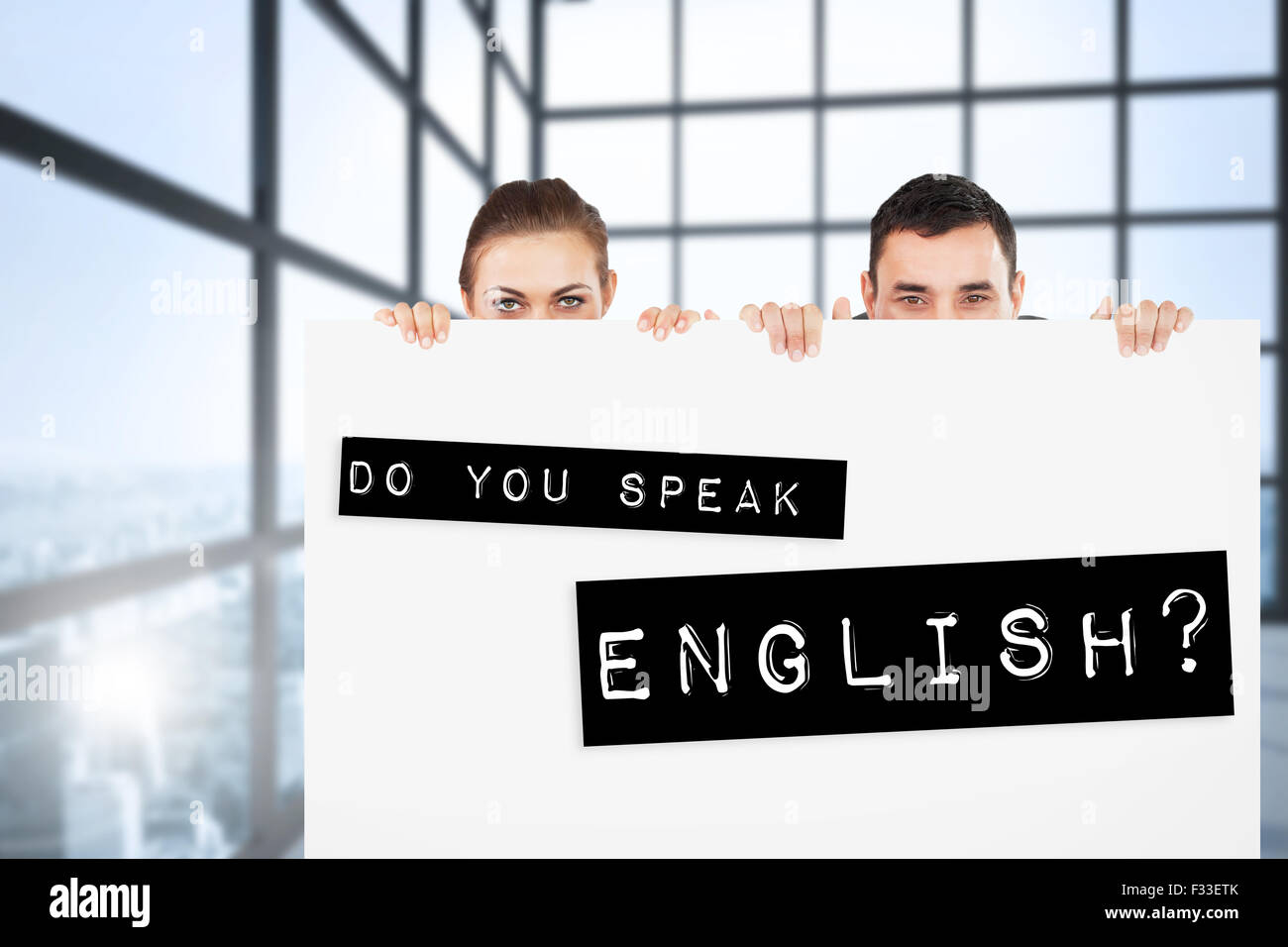 Image composite de partenaires d'affaires de se cacher derrière un signe Banque D'Images