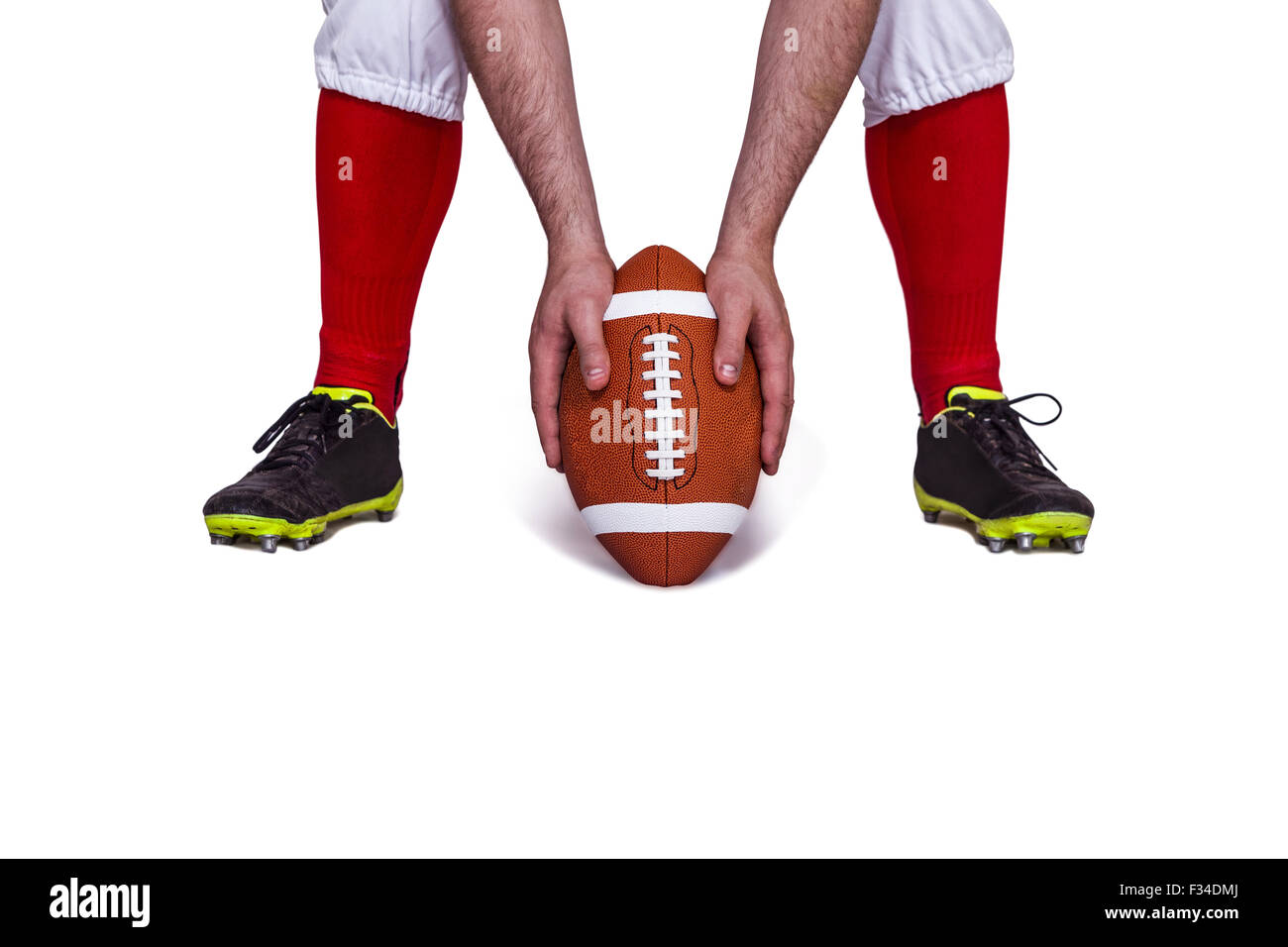 Joueur de football américain qui pousse le ballon Banque D'Images