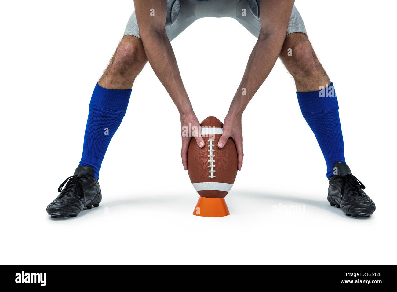 Joueur de football américain de placer entre les jambes à billes Banque D'Images