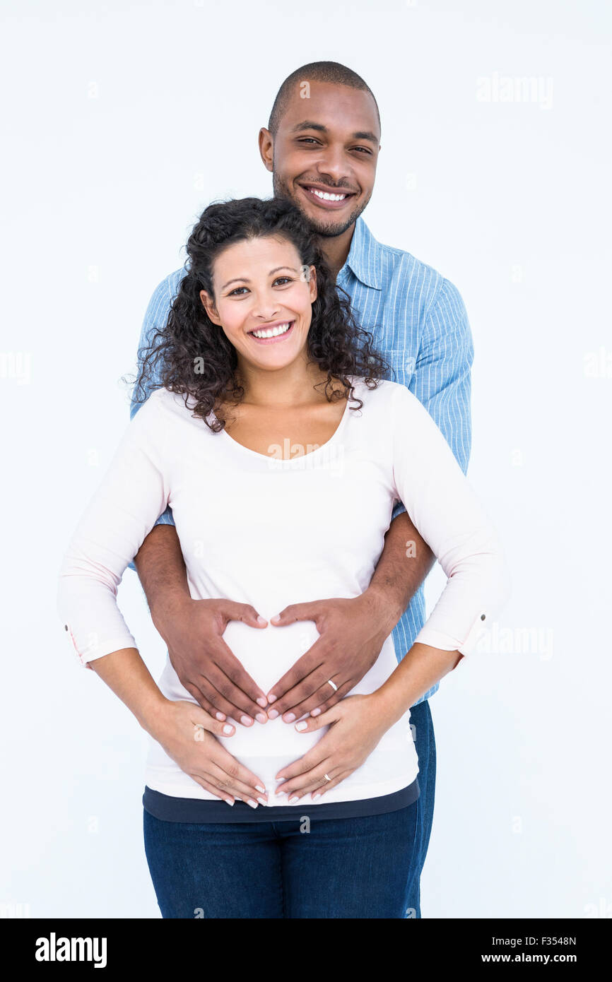 Portrait de couple avec les mains sur le ventre Banque D'Images