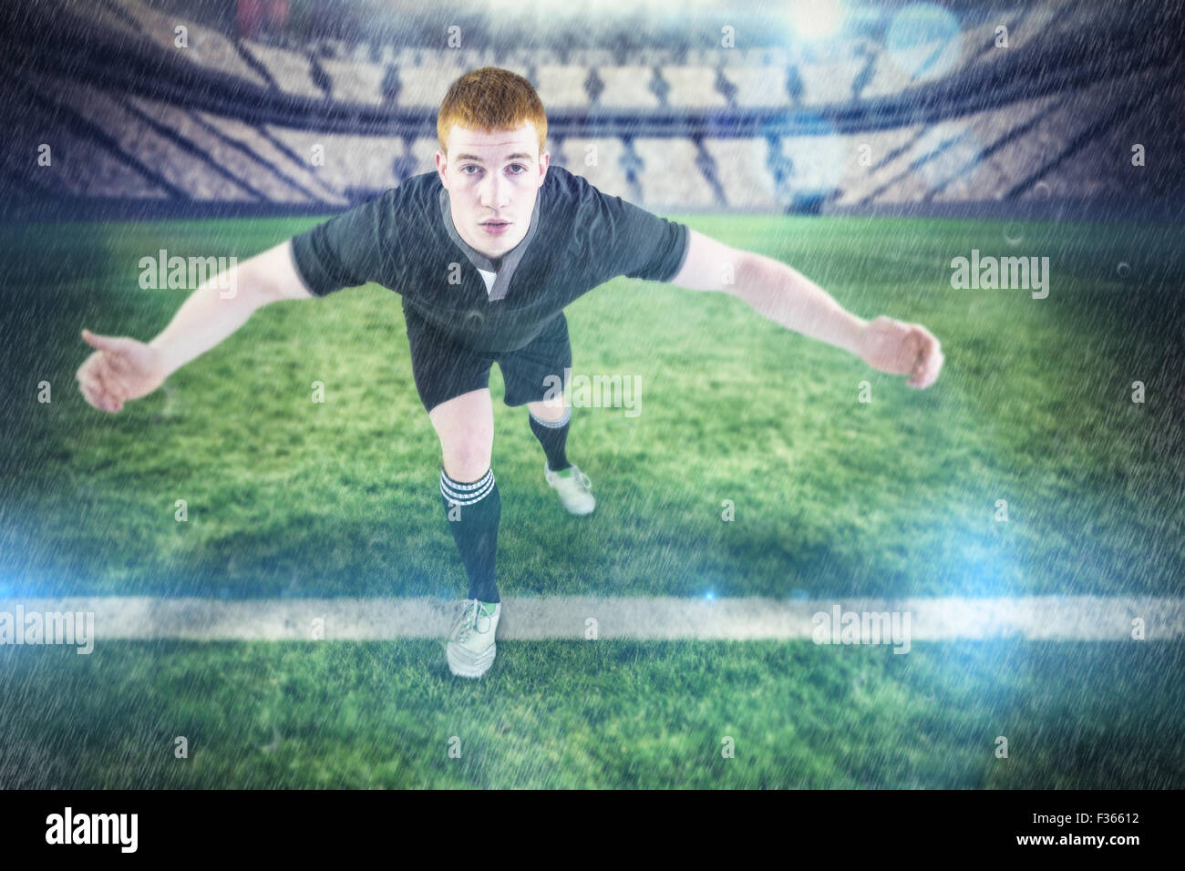 Image composite de rugby player s'attaquer à l'adversaire Banque D'Images