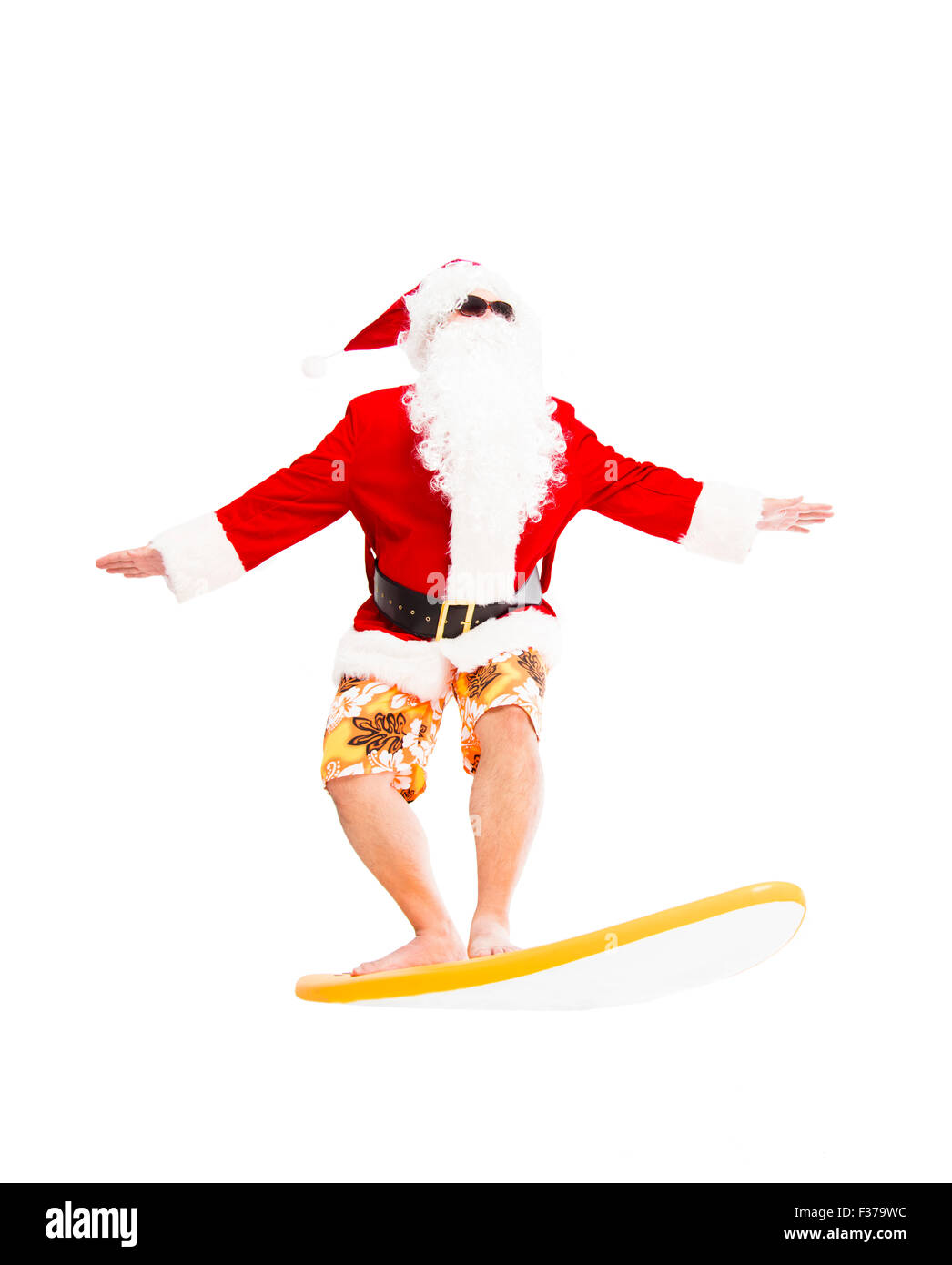 Happy Santa Claus surf avec surf board Banque D'Images