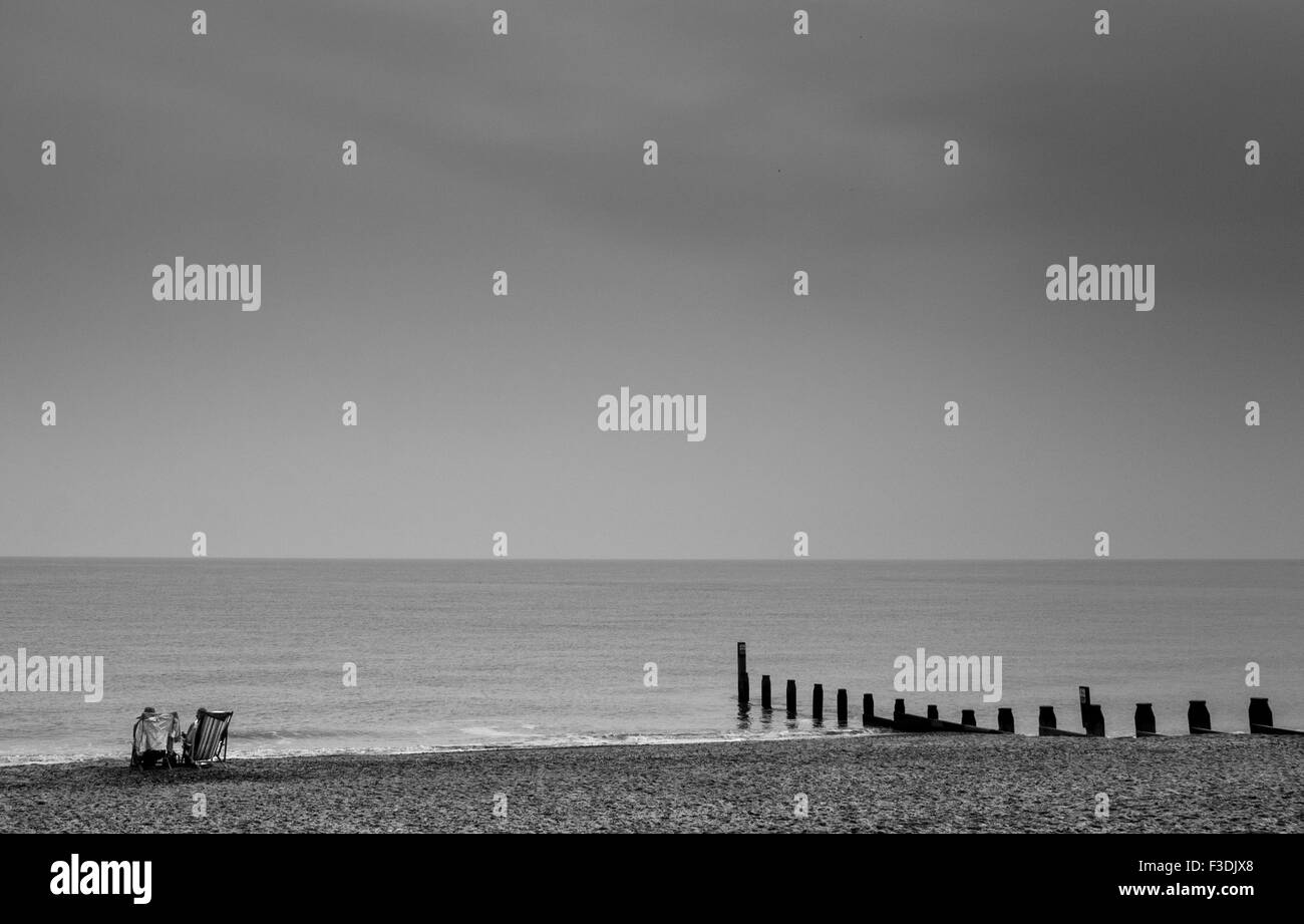 Jour nuageux à l'eau plage de Southwold Banque D'Images