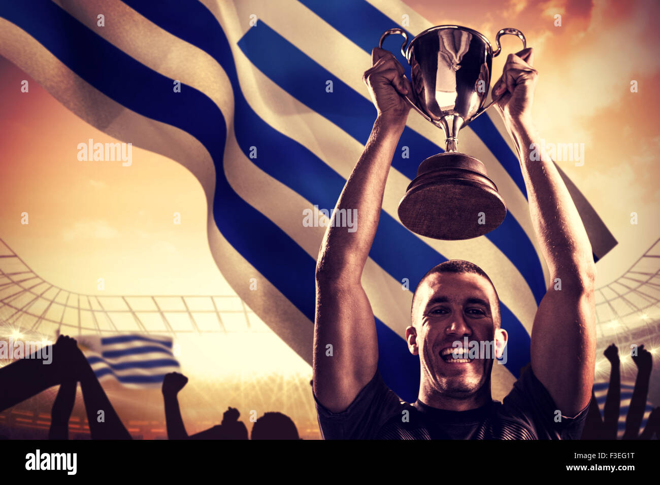 Image composite de portrait de joueur de rugby avec succès holding trophy Banque D'Images