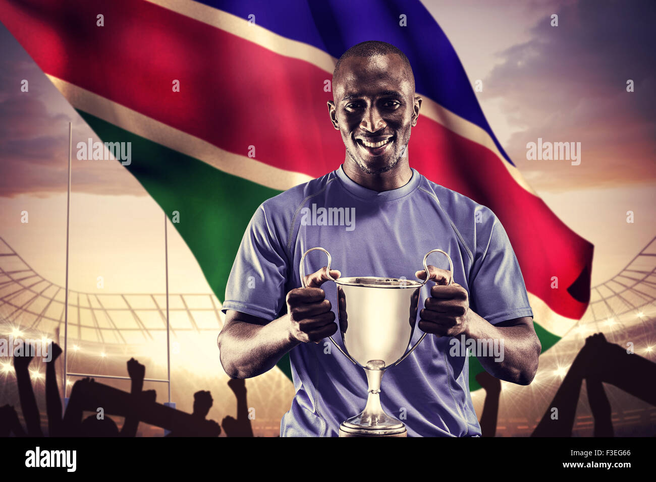 Image composite de portrait de l'athlète heureux holding trophy Banque D'Images