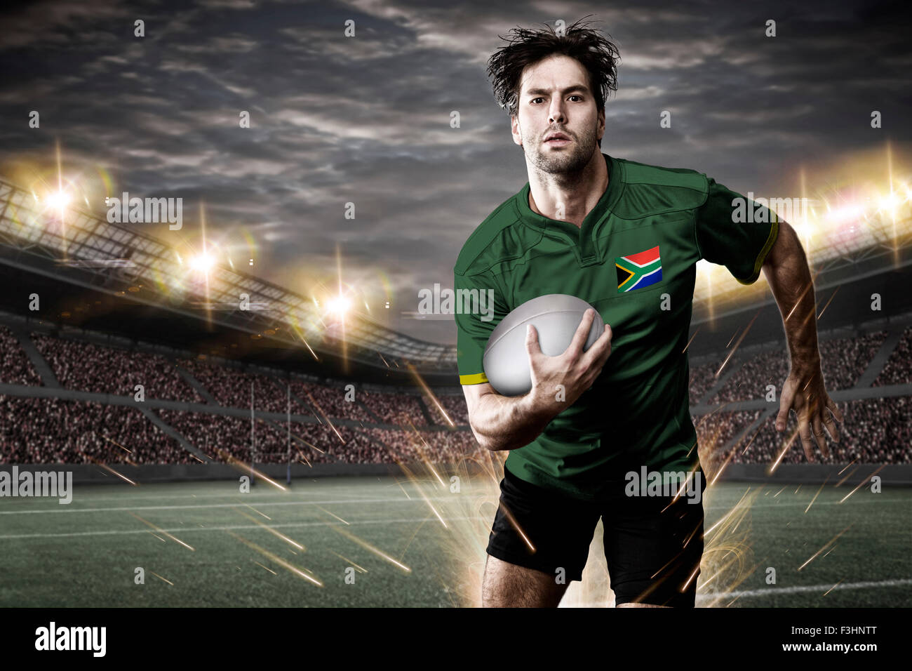 Joueur de rugby sud-africaine, le port d'un uniforme vert et or dans un stade. Banque D'Images