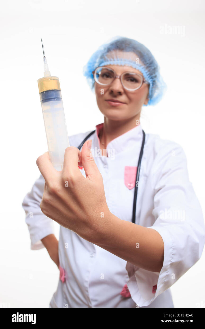 Docteur De Jeune Femme Avec La Grande Seringue Dans Des Mains Image stock -  Image du injectez, femme: 13004513