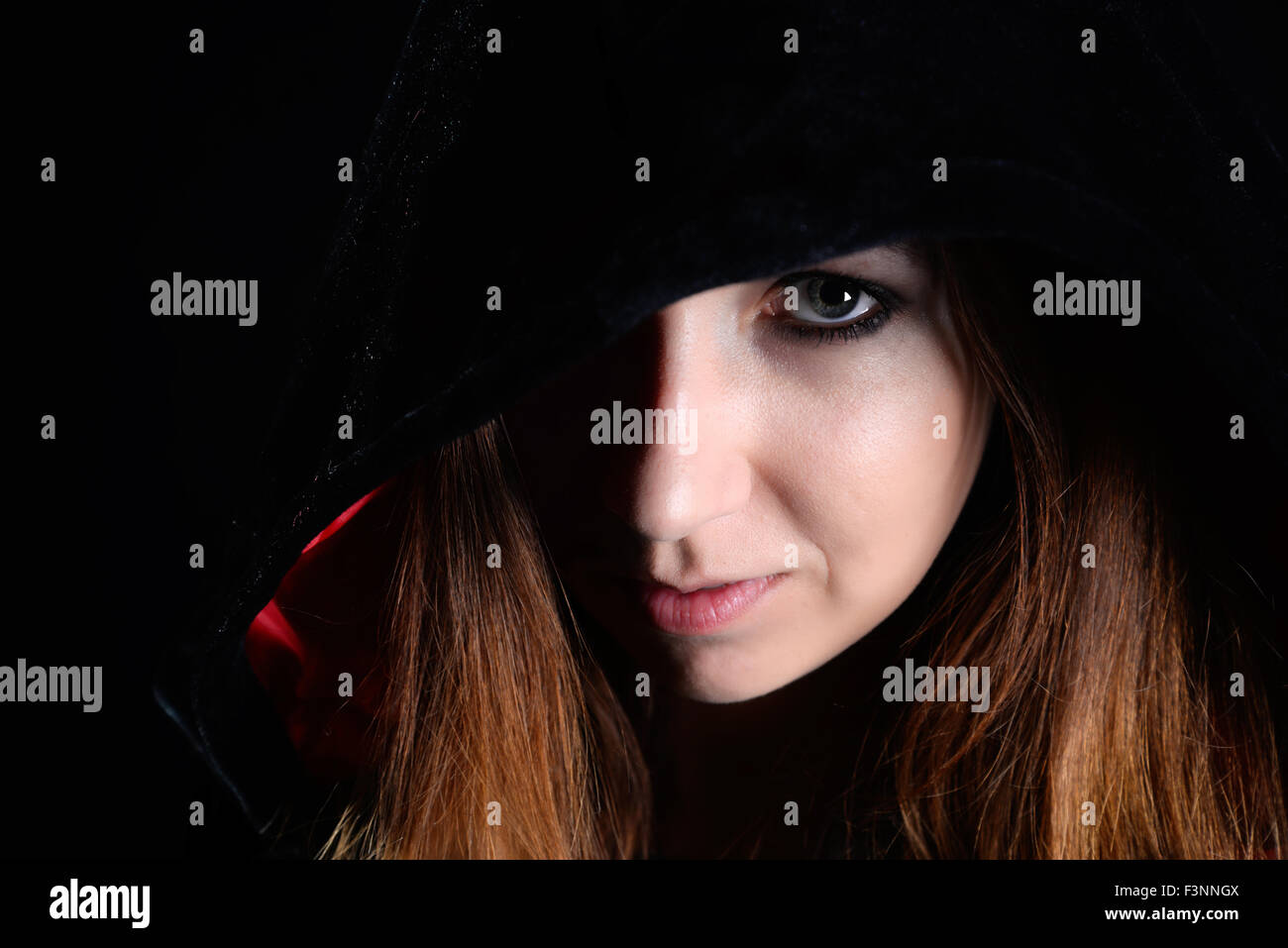 Woman in Black hood Banque D'Images