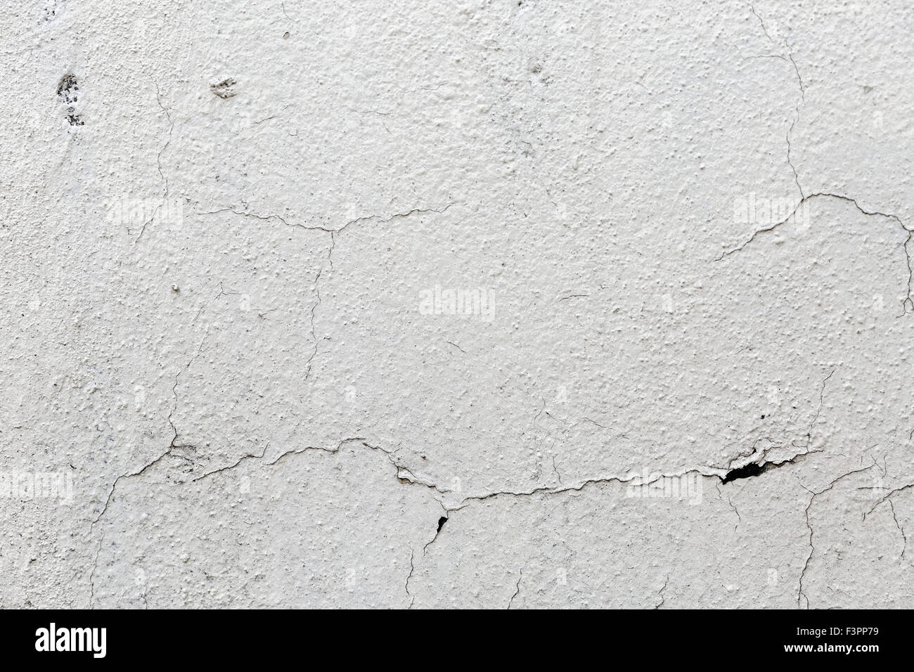 Abstract vintage texture. Vieux mur peint en blanc avec du plâtre fissuré. Banque D'Images