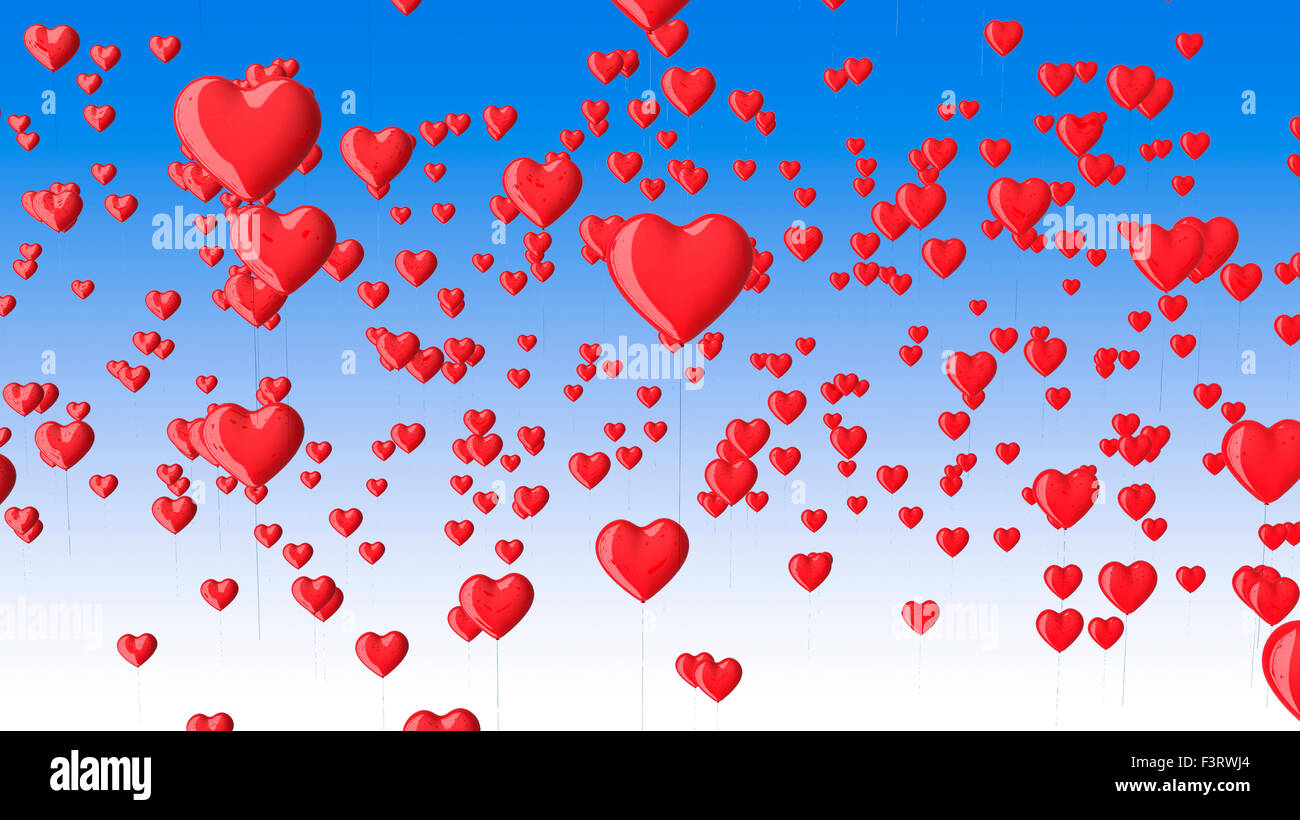 Ballons en forme de cœur rouge dans le ciel bleu. Banque D'Images
