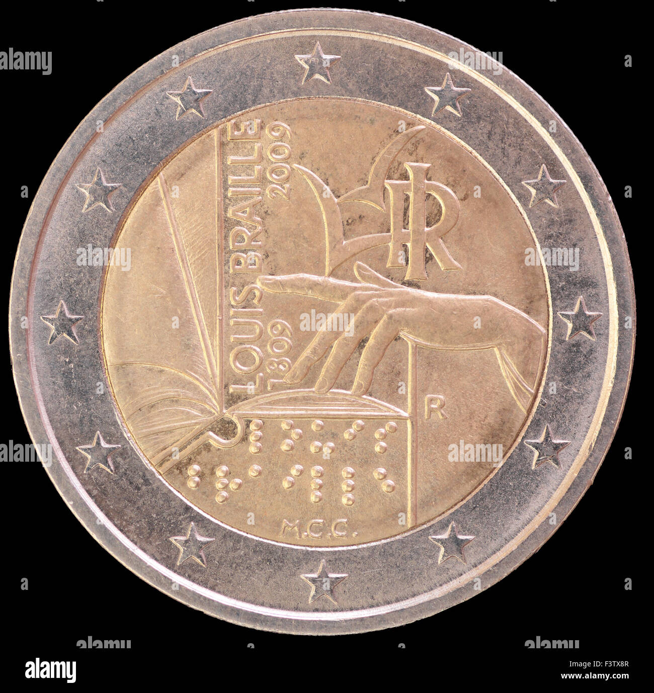 Une pièce de deux euros commémorative distribuée émis par l'Italie en 2009 représentant une part de la lecture d'un livre en braille par touch Banque D'Images