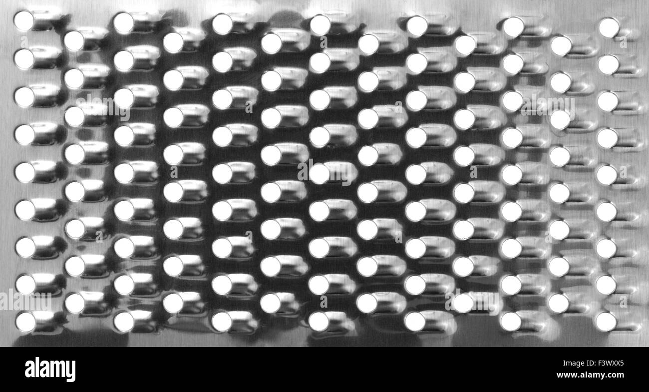 Une vue très proche d'une nouvelle râpe à fromage montrant le cycle des lames. Banque D'Images