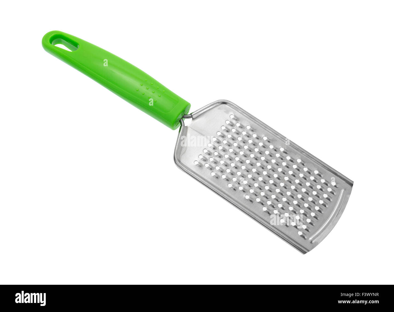 Une nouvelle râpe à fromage peu coûteux avec une poignée verte isolée sur fond blanc. Banque D'Images