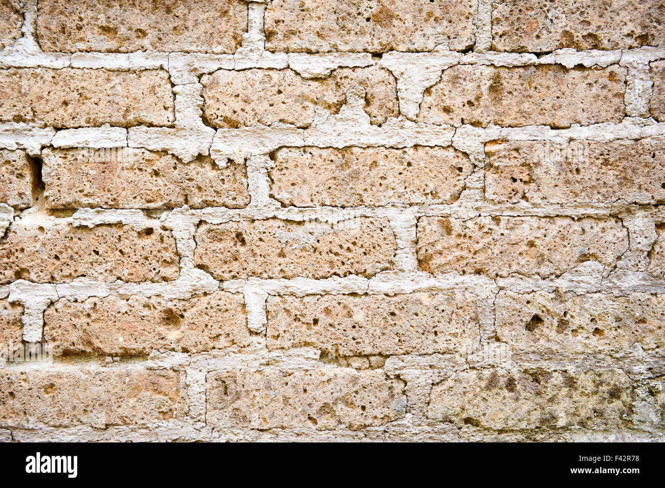 Mur de brique brune avec une lime et l'arrière-plan de surface Banque D'Images