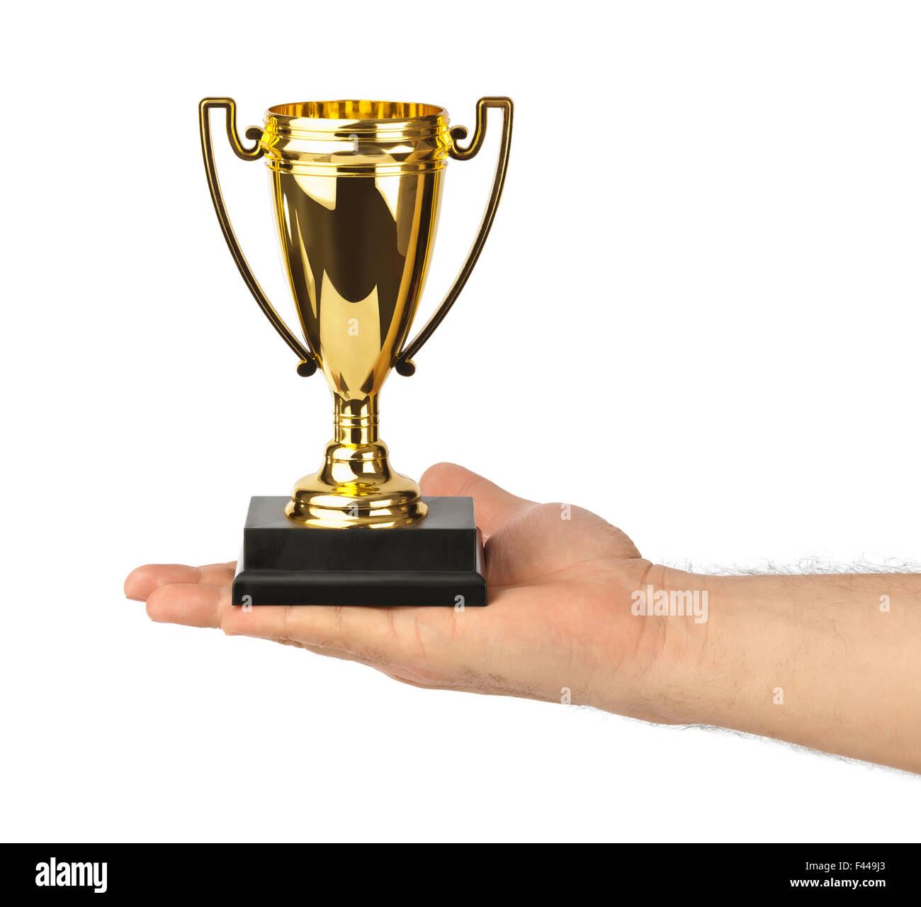 Golden Trophy cup dans la main Banque D'Images