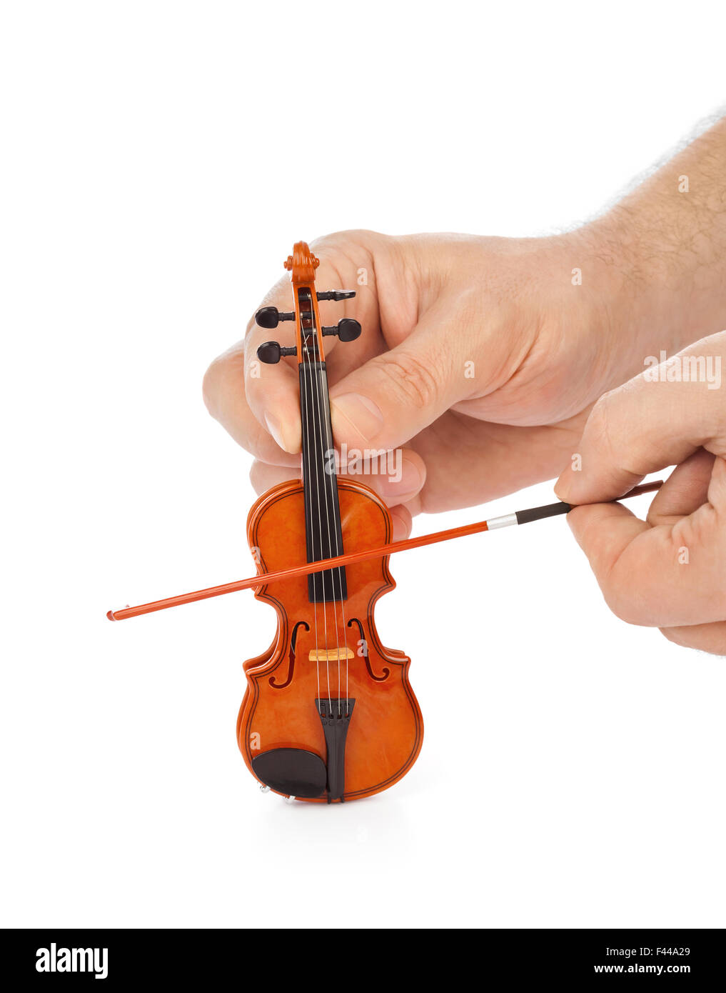 Mains et violon jouet Photo Stock - Alamy
