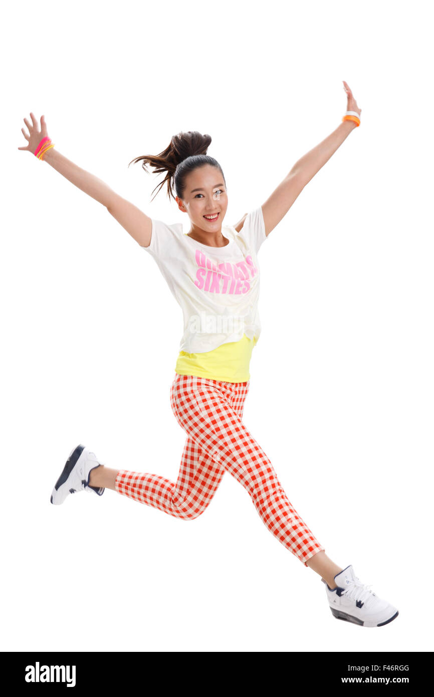 Young woman jumping Banque D'Images