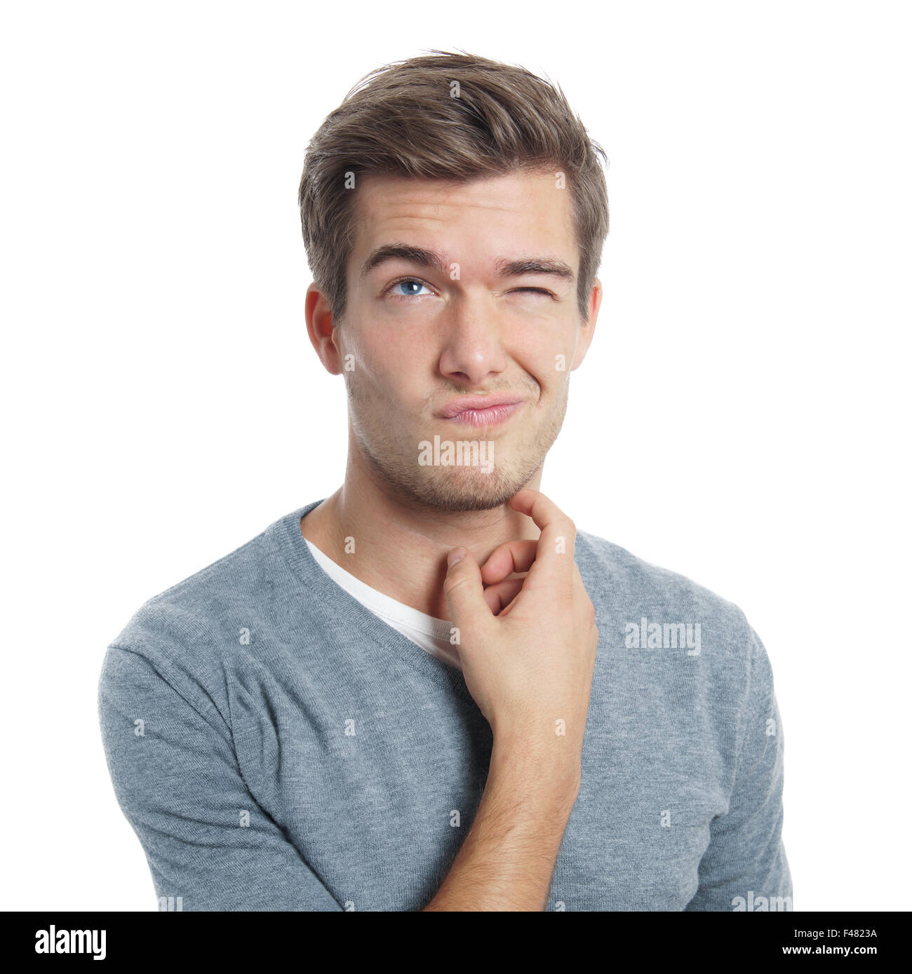 Jeune homme se gratte la tête Banque D'Images