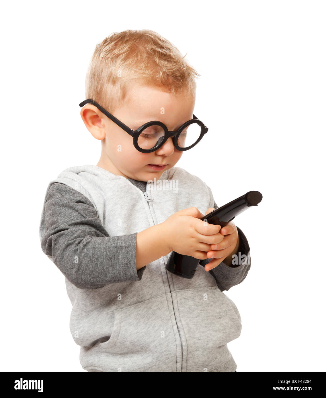 Enfant avec télécommande et lunettes drôles Banque D'Images