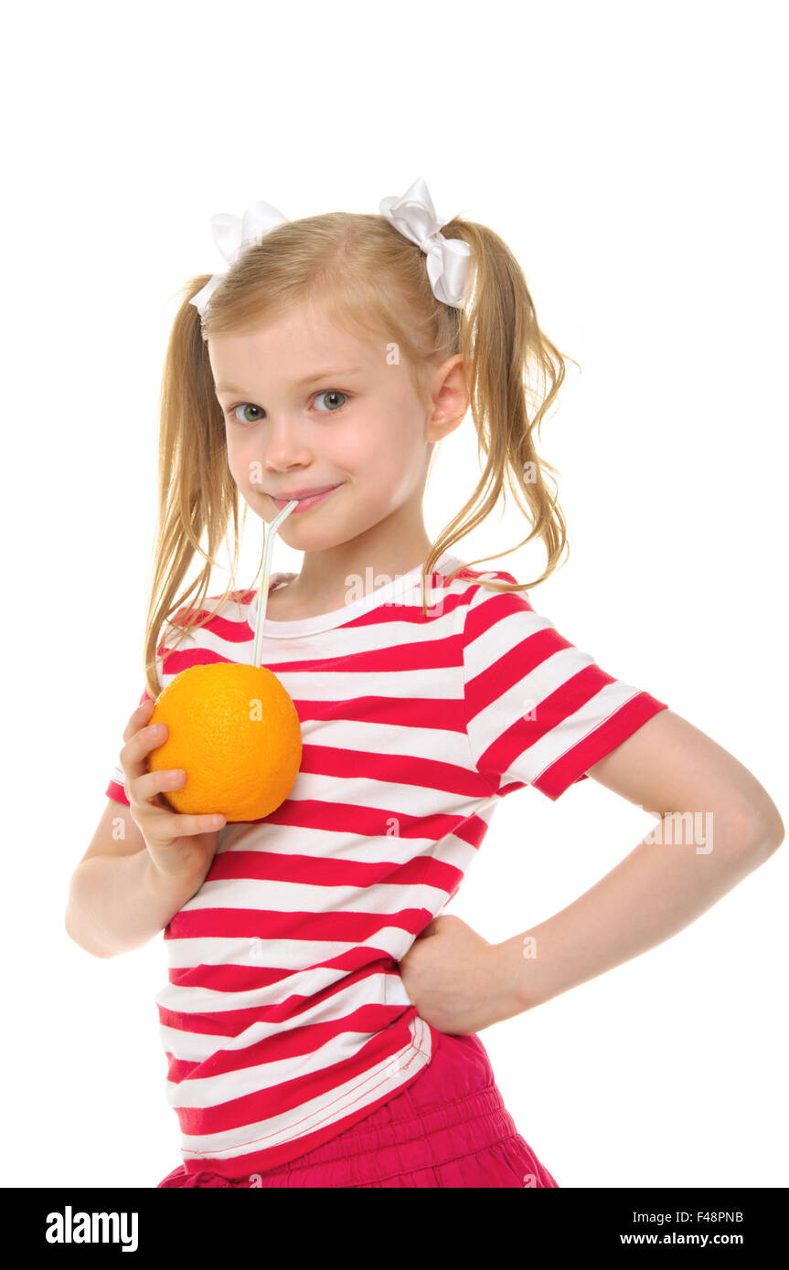 Girl drinking orange juice d Banque D'Images