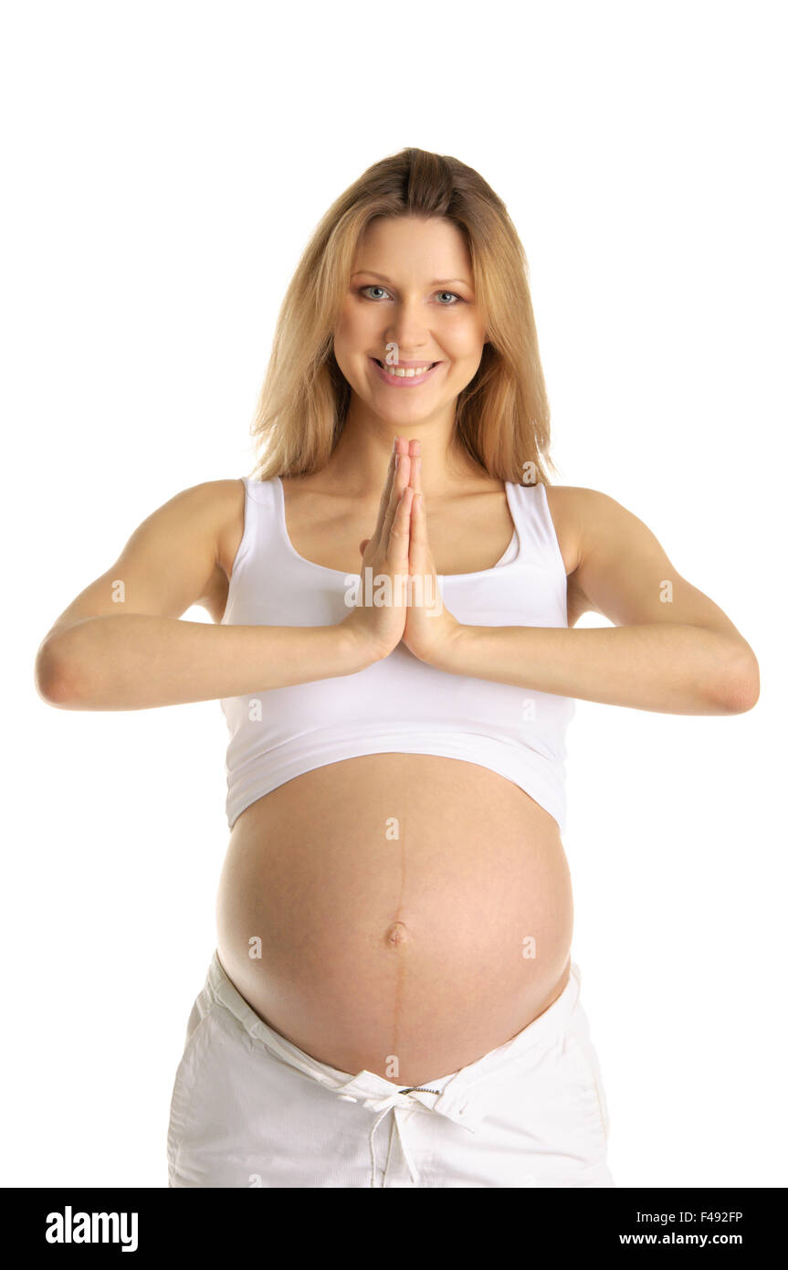 Pregnant woman practicing yoga Banque D'Images