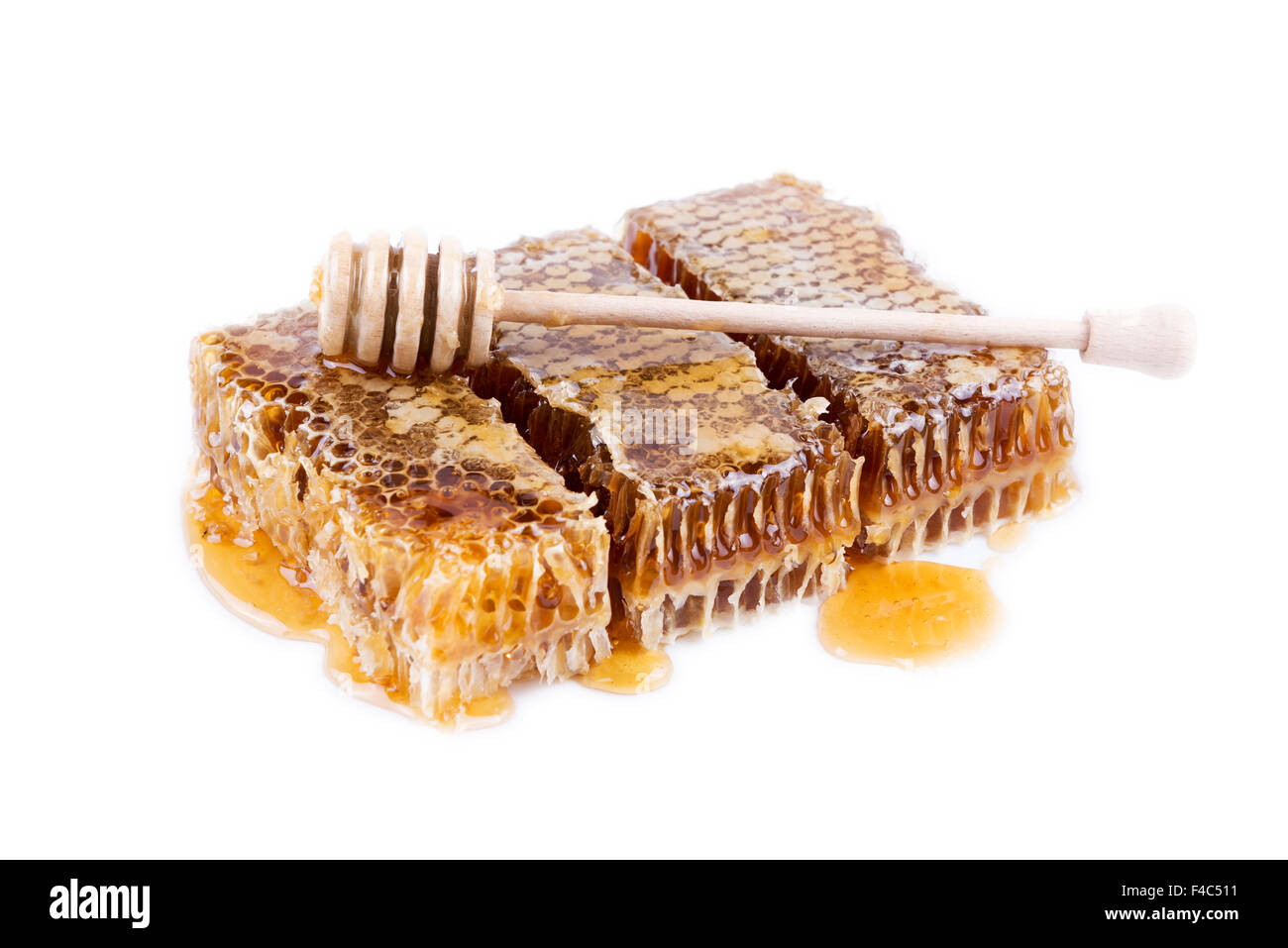 Avec du miel d'abeilles et de miel stick sur fond blanc Banque D'Images