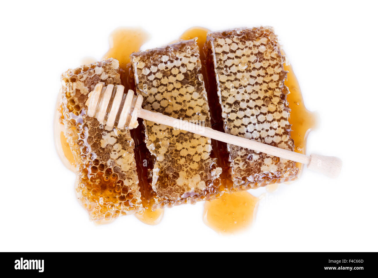 Avec du miel d'abeilles et de miel stick sur fond blanc Banque D'Images