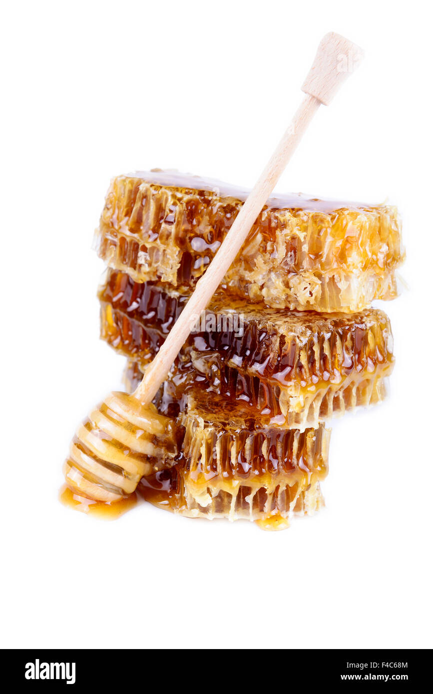 Avec du miel d'abeilles et de miel stick sur fond blanc Banque D'Images