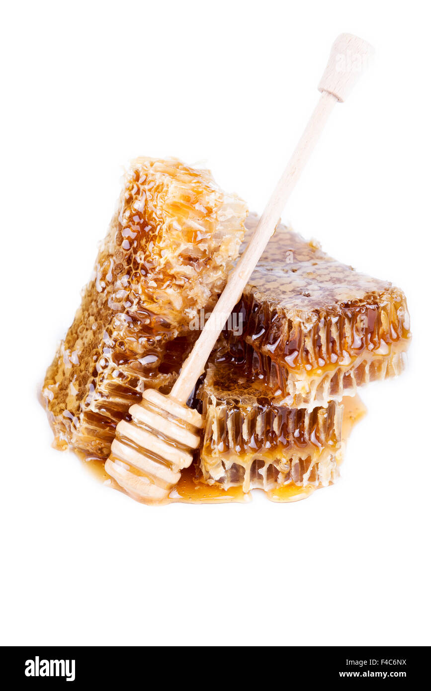 Avec du miel d'abeilles et de miel stick sur fond blanc Banque D'Images