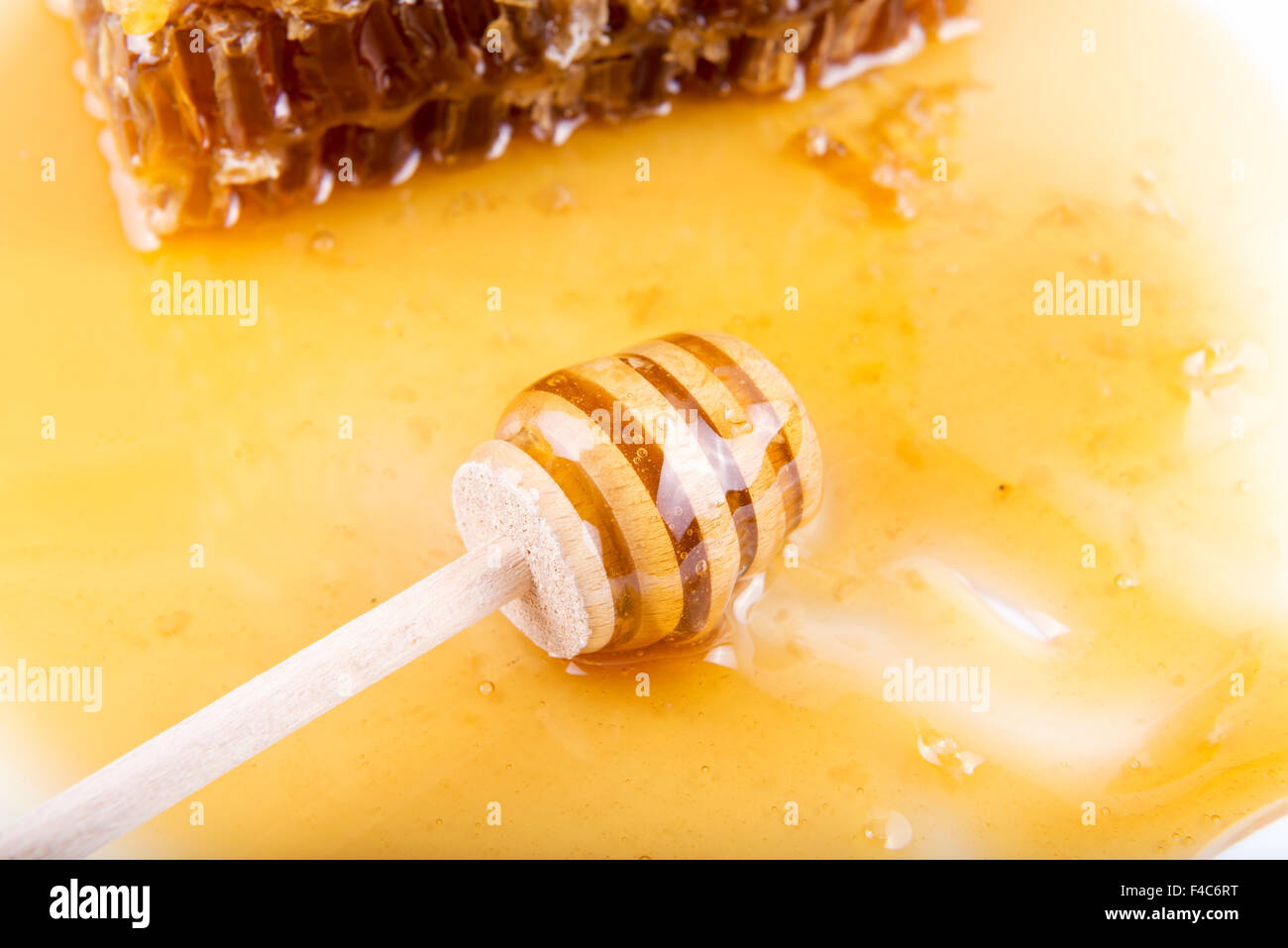 Avec du miel d'abeilles et de miel stick Banque D'Images