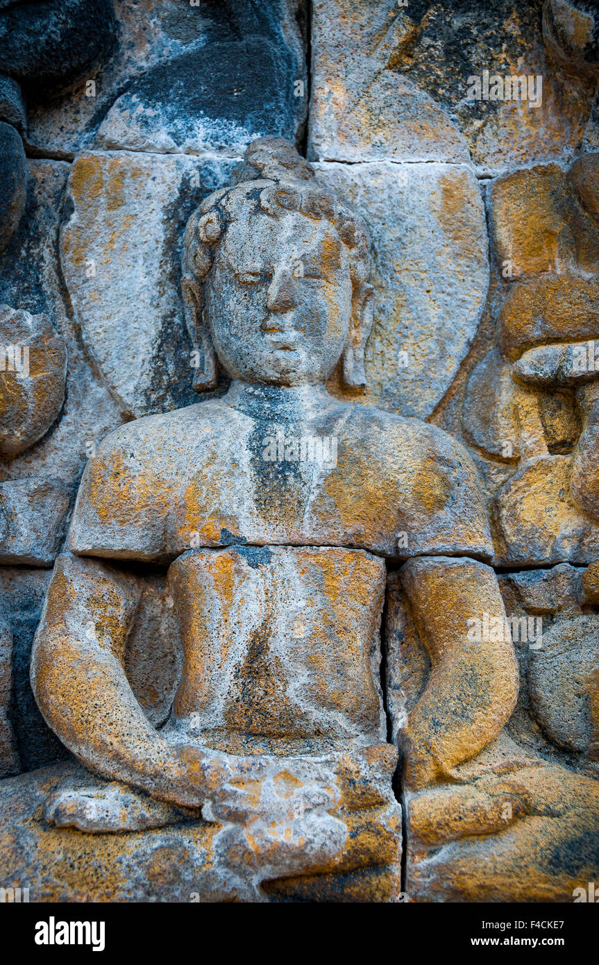Encarved Bouddha assis en pierre, Borobudur Banque D'Images