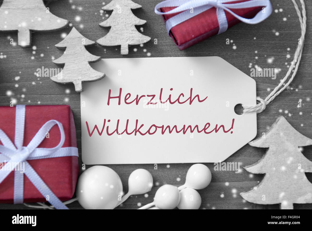 Étiquette de Noël Flocons de cadeaux Herzlich Willkommen BIENVENUE Moyen Banque D'Images