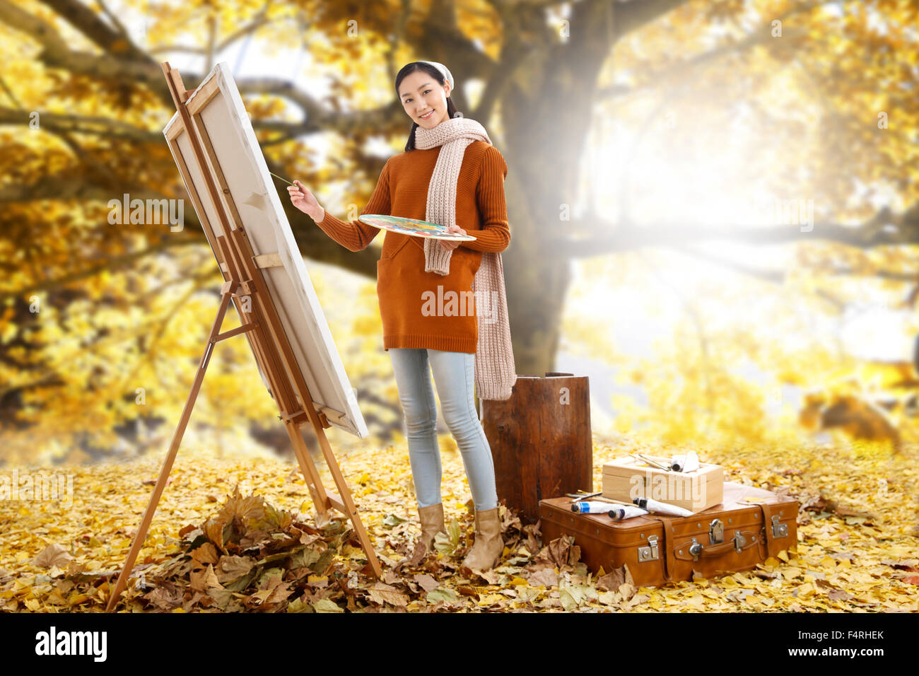 Les jeunes femmes de la peinture de plein air Banque D'Images