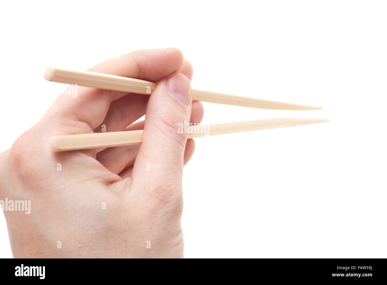Main tenant de baguettes. Le tout sur fond blanc Banque D'Images