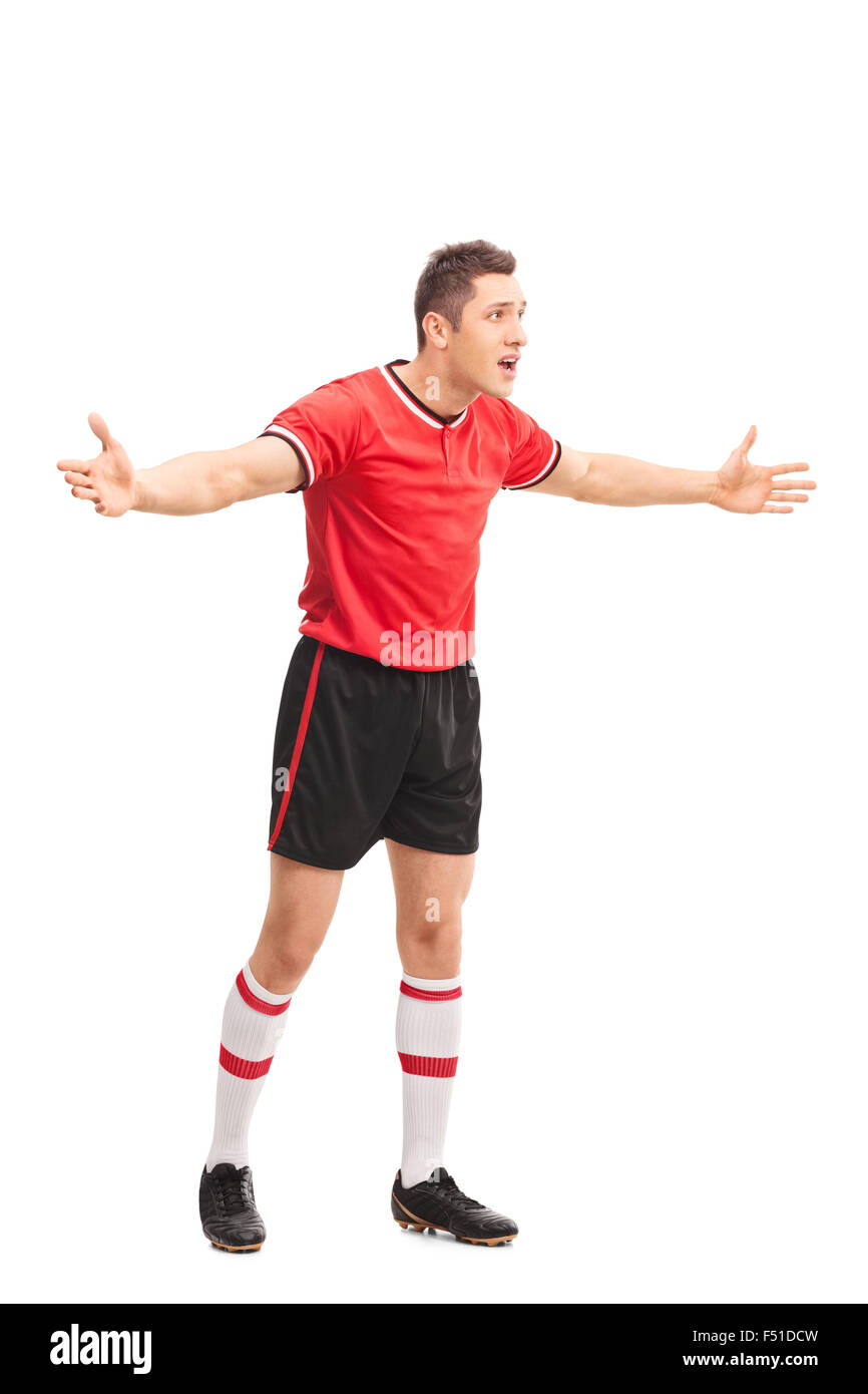 Portrait d'un joueur de football mécontent des gestes avec ses mains isolé sur fond blanc Banque D'Images