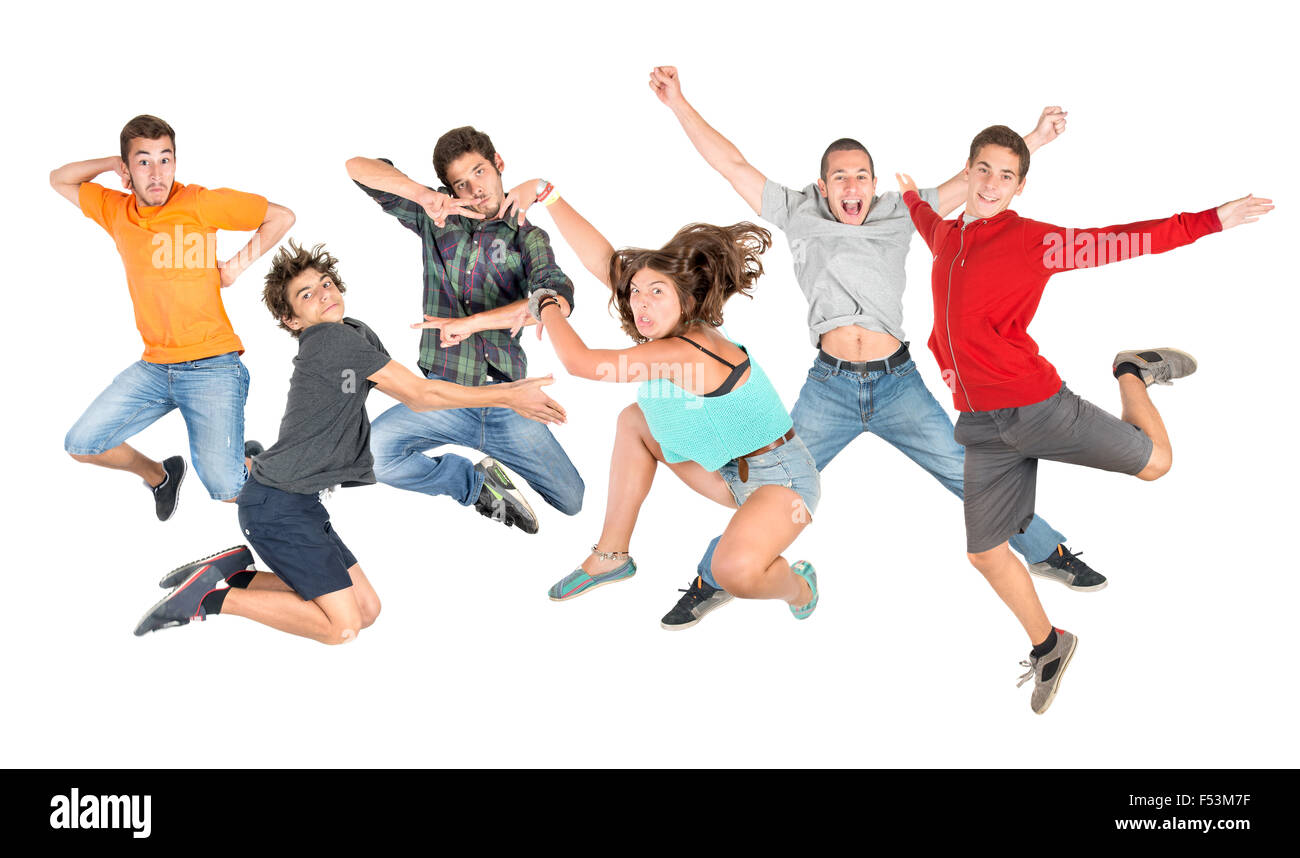 Groupe d'adolescents heureux isolé de saut en blanc Banque D'Images