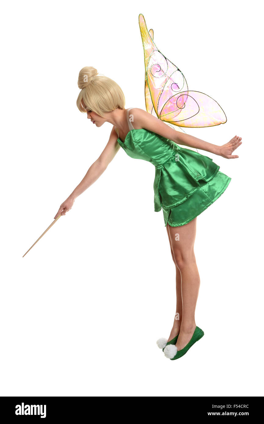 Jeune femme vêtue d'être mythologique en utilisant la baguette magique Banque D'Images