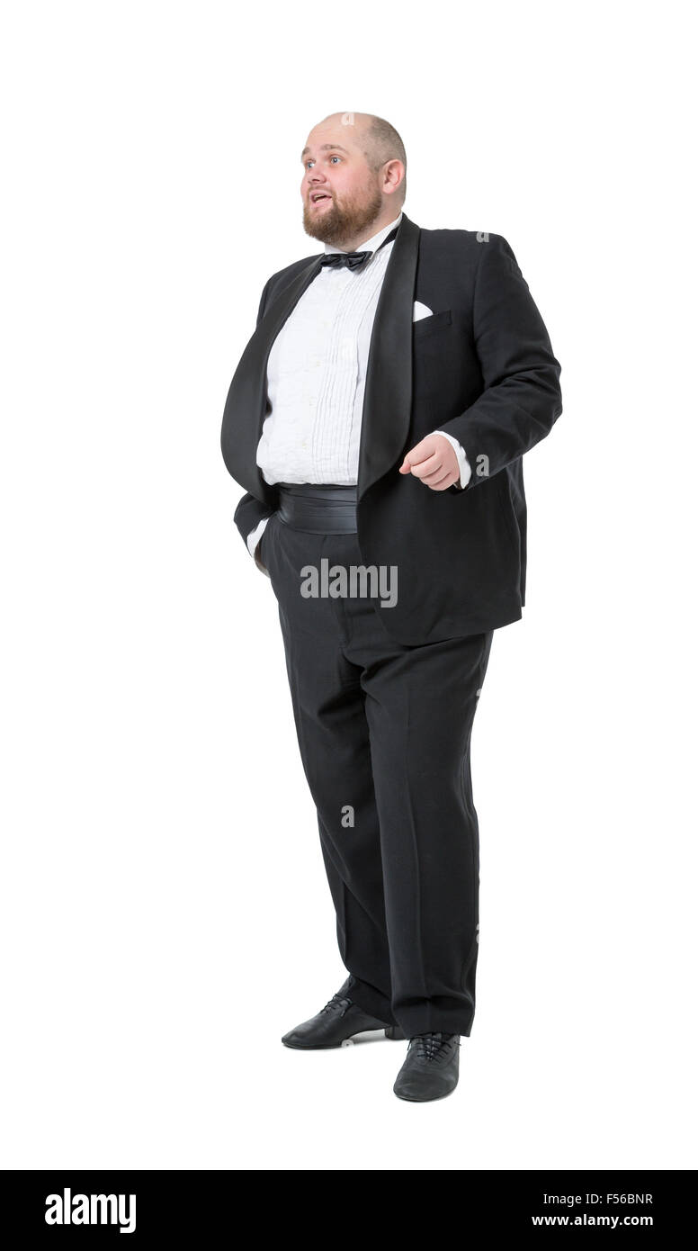 Jolly Fat Man in Tuxedo and Bow tie montre des émotions, sur fond blanc Banque D'Images