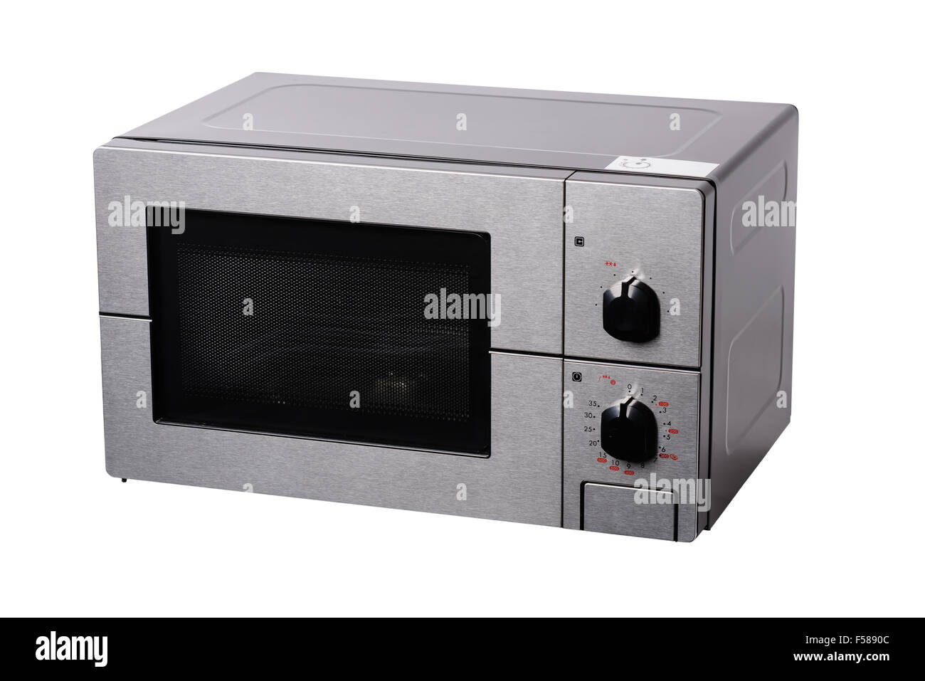 Four micro-ondes couverts métalliques avec la numérotation manuelle, isolé sur blanc. Banque D'Images