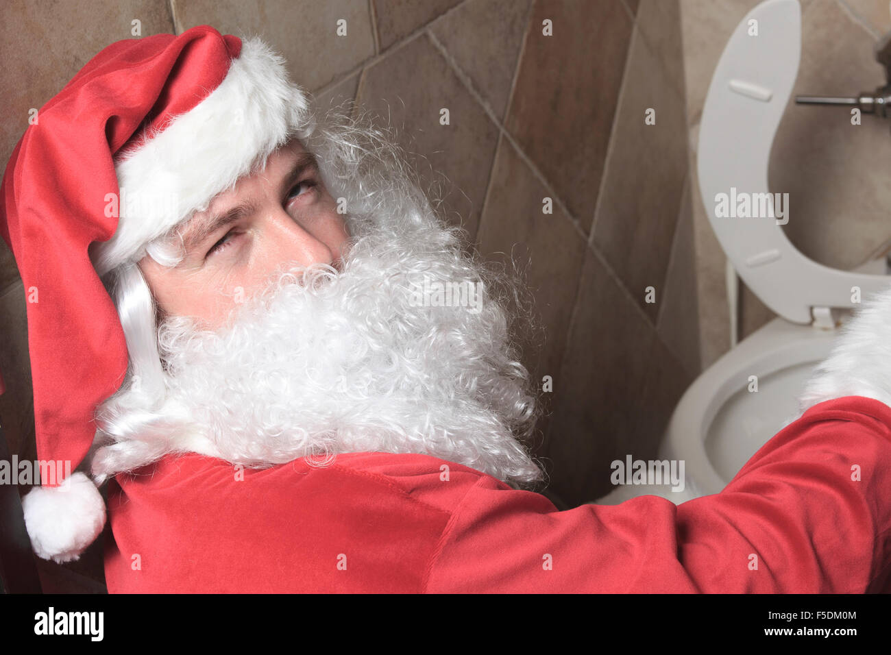 Santa claud sic au bar toilettes Banque D'Images