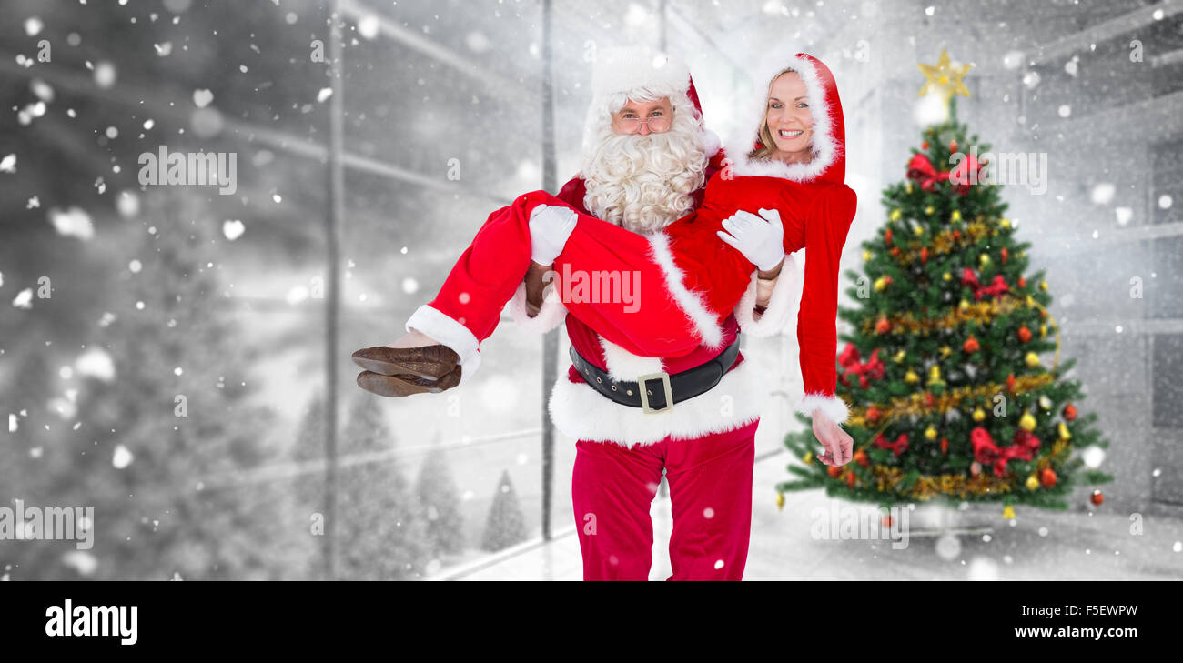 Image composite de santa et Mme claus smiling at camera Banque D'Images