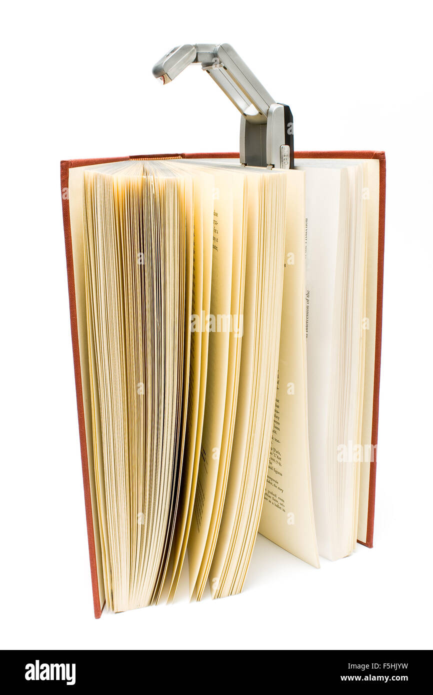 Livre voyage livre relié sur rouge lampe isolated on white Banque D'Images