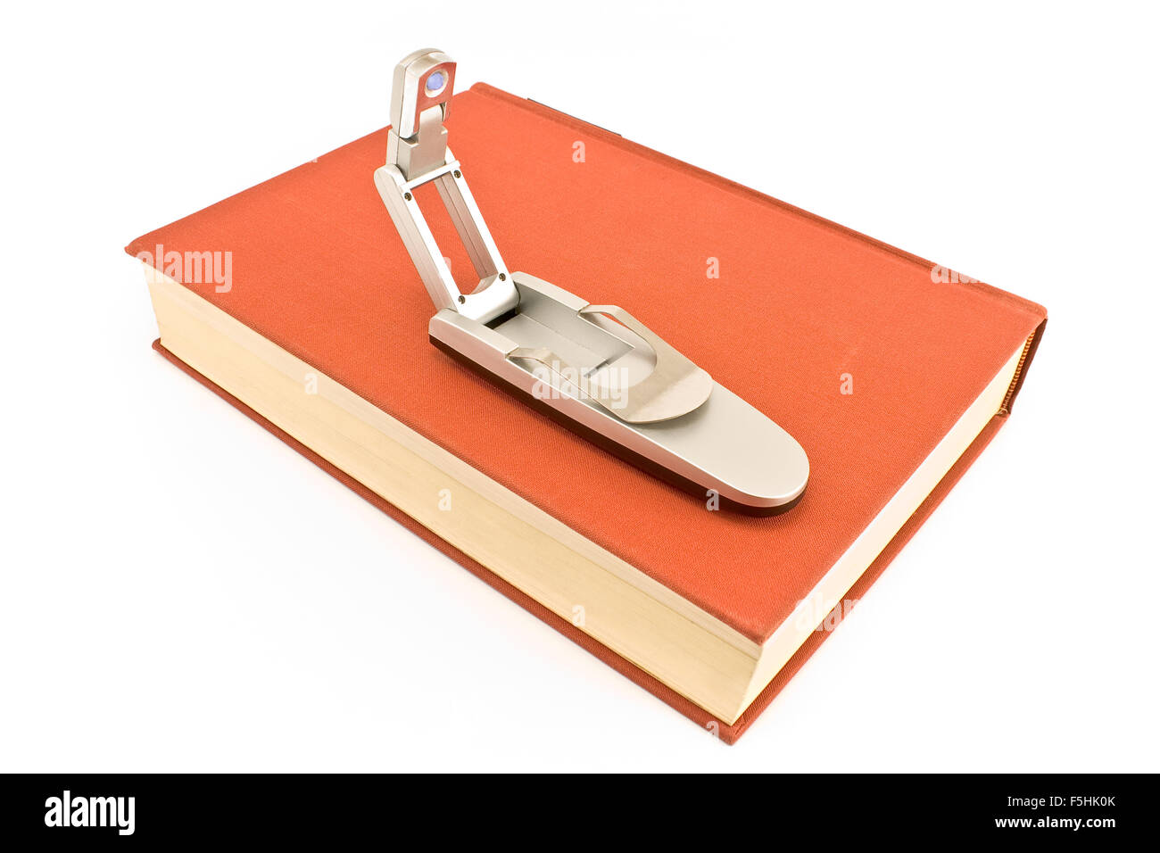 Livre voyage livre relié sur rouge lampe isolated on white Banque D'Images