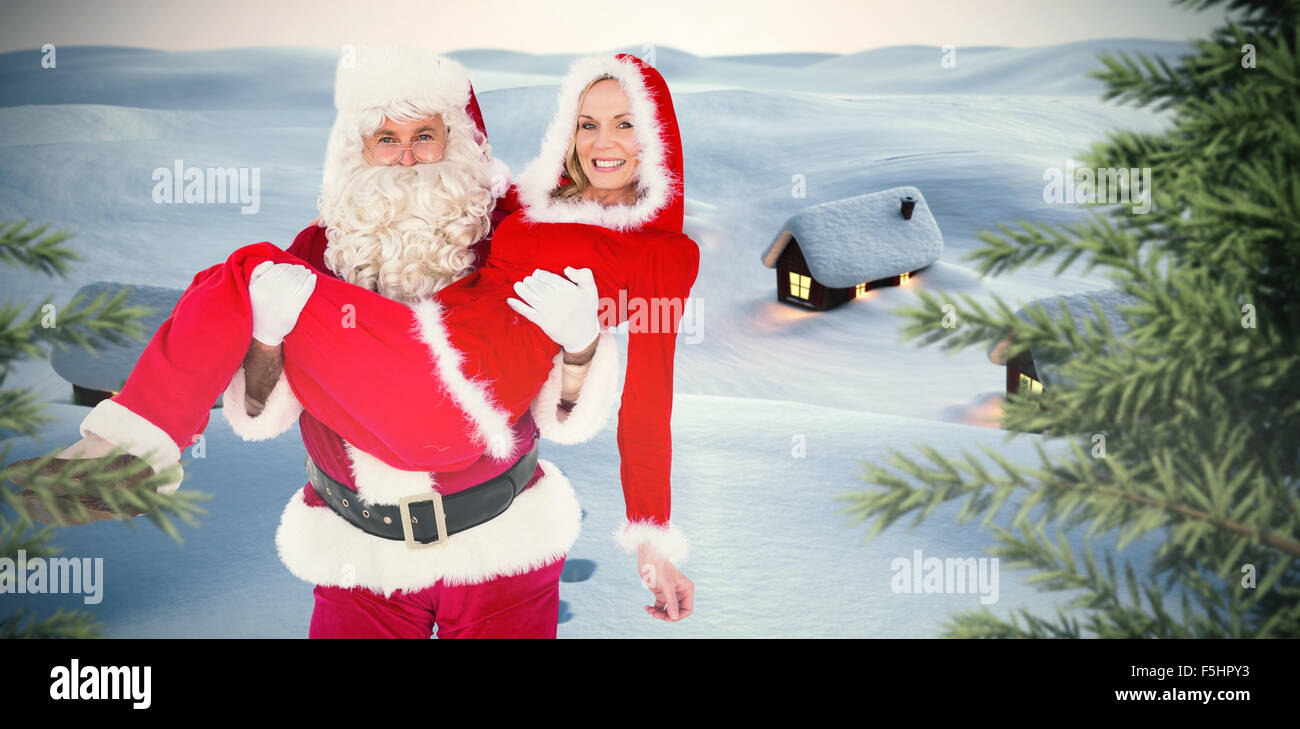 Image composite de santa et Mme claus smiling at camera Banque D'Images
