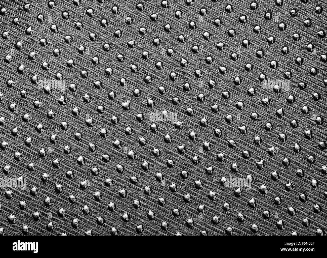 Tissu gris foncé texture background avec boutons de métal Banque D'Images