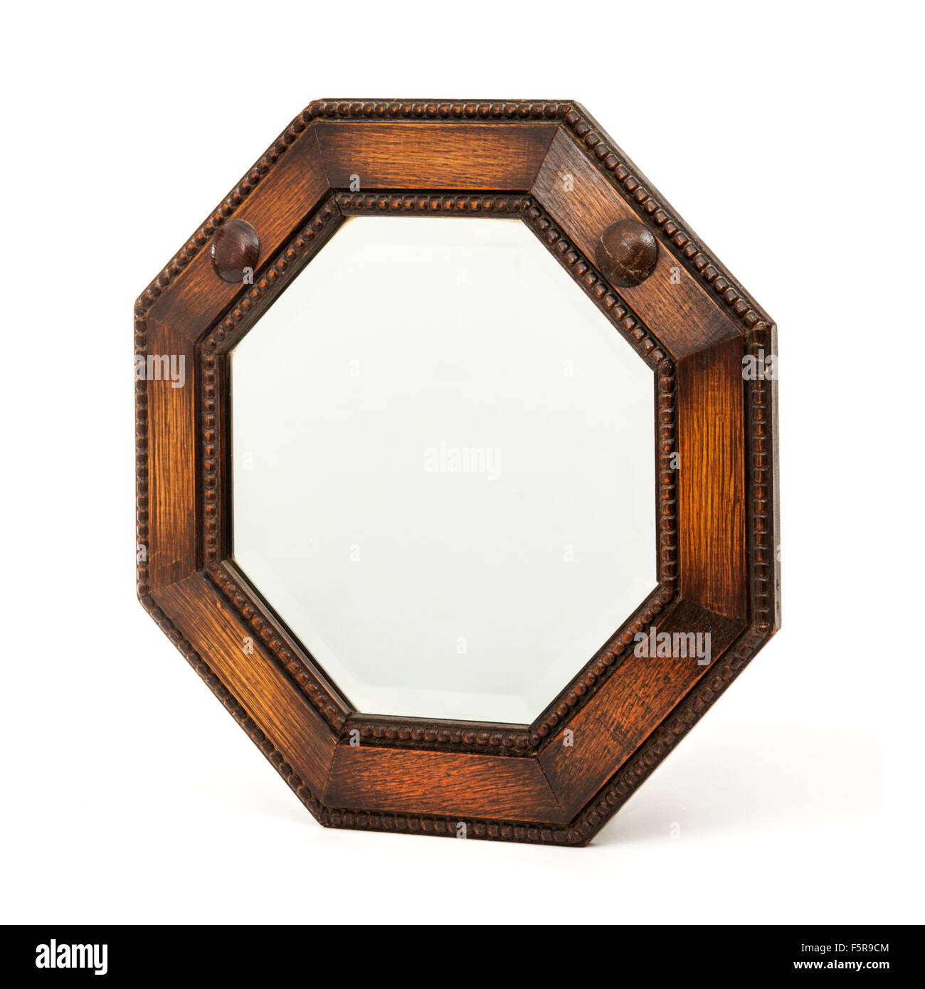 Meubles anciens en bois octogonale avec miroir en verre biseauté Banque D'Images