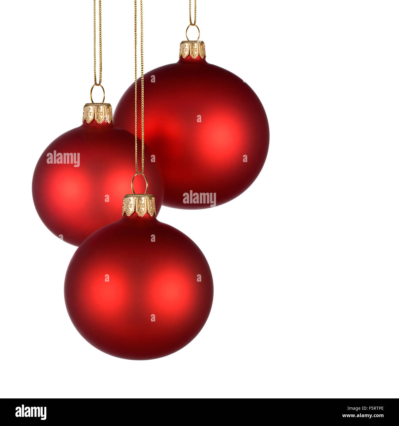 Arrangement de Noël avec trois boules rouges sur fond blanc, pur pour votre texte et/ou de la conception Banque D'Images